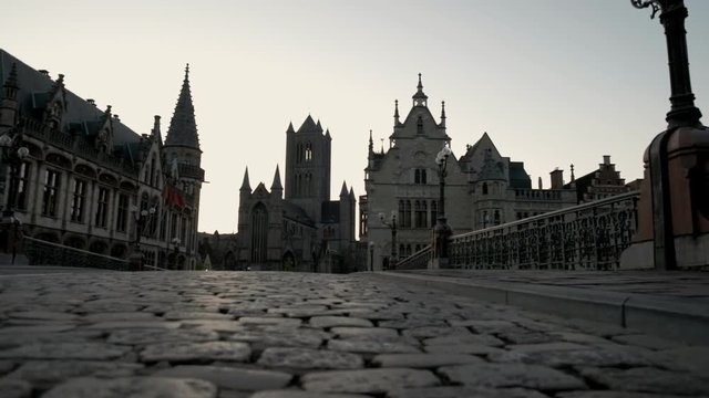 Low angle slide shot of Ghent old town and churches from St Michael's Bridge. Taken during a spring morning twilight