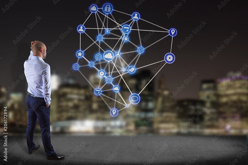Aufkleber businessman in front of a wall with a business network connection displayed on a futuristic interfac