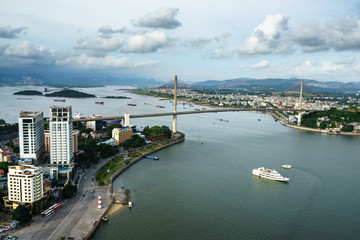 Obraz premium Halong city aerial view with Bai Chay bridge in Quang Ninh province, Vietnam