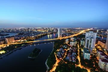 Fototapeta premium Aerial skyline view of Hanoi cityscape at twilight. Linh Dam peninsula, Hoang Mai district, Hanoi, Vietnam