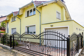 house with wrought iron fence