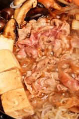 Japanese Sukiyaki Pot with pork and vegetable.