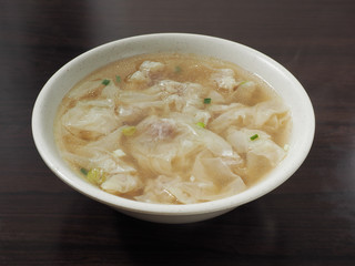 Wonton soup  in a bowl. Traditional asian food.  