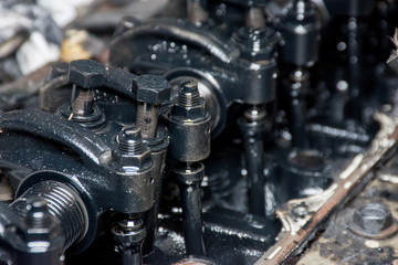 Details of a dirty diesel engine under the hood of an car