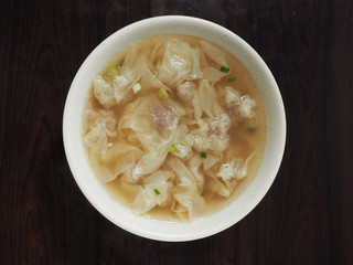 Wonton soup  in a bowl. Traditional asian food.  