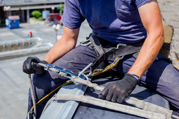 Industrial climber is prepare his ropes