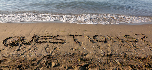 huge text QUESTIONS on the  beach