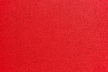 Textured bright red artistic grainy background