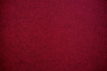 Textured maroon artistic grainy background