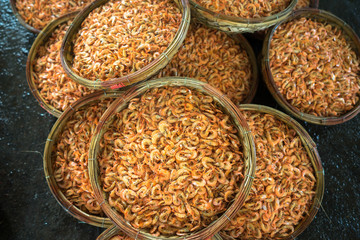 Boiled little shrimp baskets. Seafood processing at fish market in Quy Nhon, south Vietnam