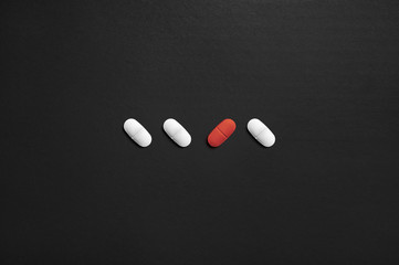 One different pill. Unique or individual. Mental health care, loneliness or malpractice. Wrong or...