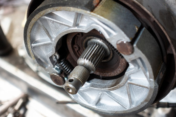 Old motorcycle drum brake pad in opened engine box