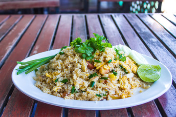 Stir-fried rice cilantro with coriander leaves on white table