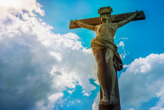 Crucifixion with Jesus against the sky with clouds - concept of faith