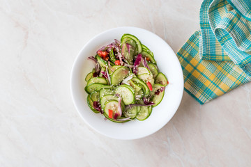 Asian Cucumber Salad with Sesame and served with Chopsticks.