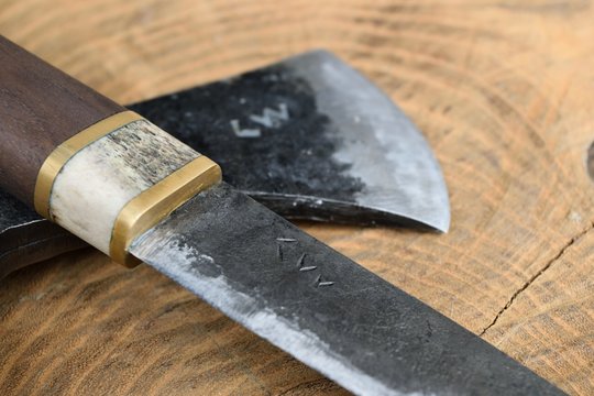 Hand forged puukko knife and tomahawk