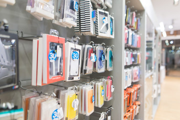 Showcase with smartphone case covers in the accessories store in the technology store