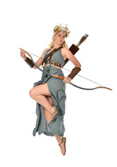 full length portrait of pretty blonde lady wearing fantasy toga gown,  and holding a bow and arrow. standing pose on white background. © faestock