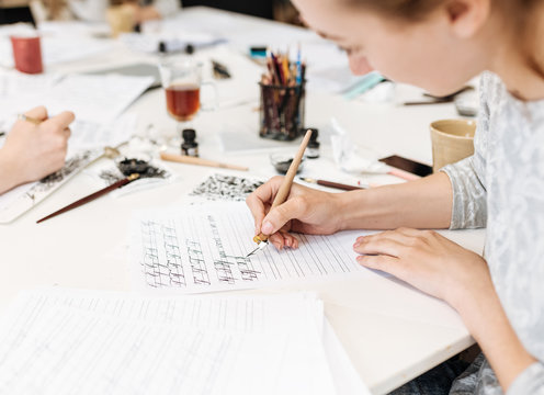 Lecture and training in calligraphy office for a group of people.