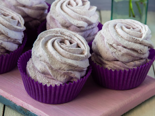 Lavender marshmallow.Homemade marshmallows on a light background. Purple marshmallows on the board. Home blue marshmallow.