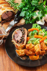 Pork tenderloin in wellington style in puff pastry