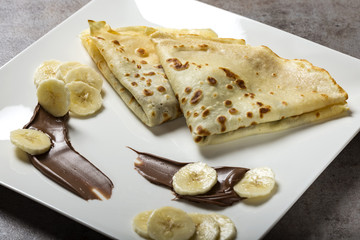French style crepes with banana, chocolate sauce