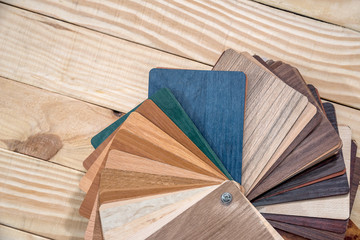 Obraz na płótnie Canvas Samples of laminate wooden planks for furniture decor