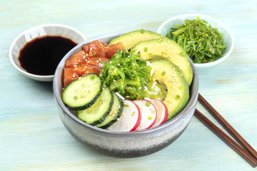 Hawaiian tuna poke salad with wakame and sauce