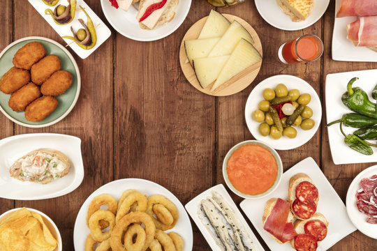 The food of Spain. Overhead photo of many different Spanish tapas with a place for text