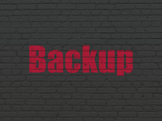 Fototapeta na wymiar Database concept: Painted red text Backup on Black Brick wall background