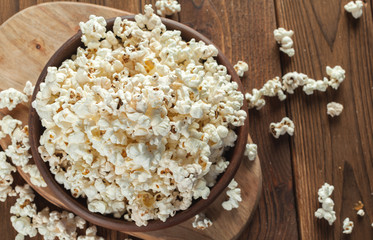 Salt popcorn on the wooden table