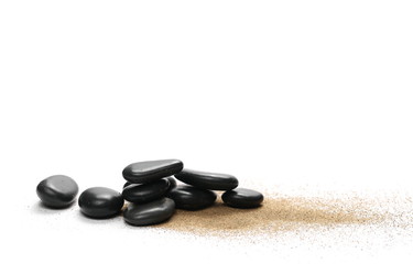 Black stones in sand pile isolated on white background