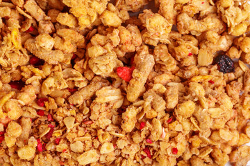 Homemade roasted granola on baking sheet breakfast food background