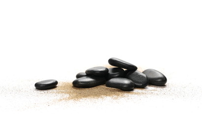 Black stones in sand pile isolated on white background