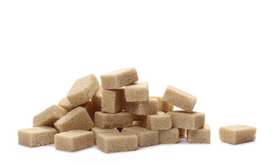 Brown cane sugar cubes isolated on white background
