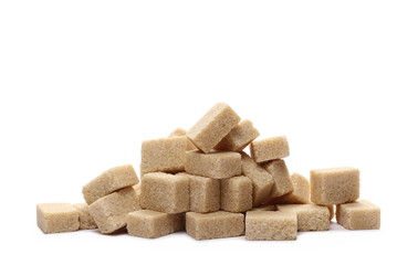 Brown cane sugar cubes isolated on white background