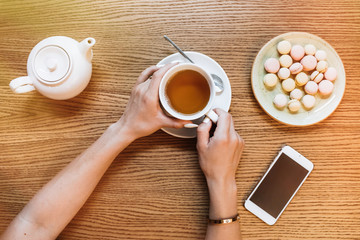 Young gorgeous lady chatting on her smart phone while relaxing i