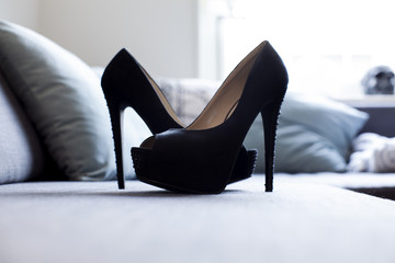 Black High Heels on a Couch