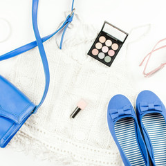 Female summer fashion accessories flat lay with flats, purse, knit top, sunglasses and cosmetics