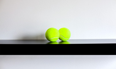 Tennis Balls on a shelf