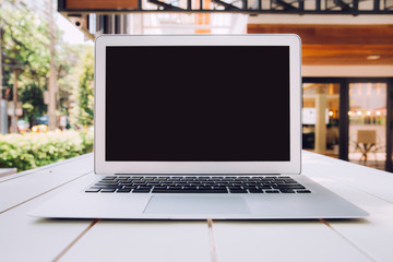 Modern computer, laptop with blank screen on white table. Copy space for text or create montage product display.