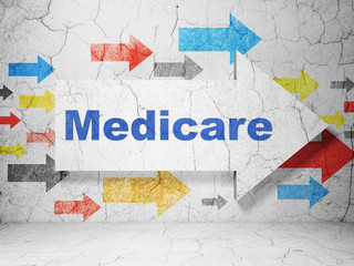 Health concept:  arrow with Medicare on grunge textured concrete wall background, 3D rendering