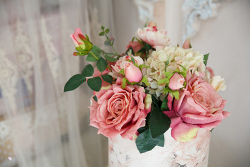 Delicate bouquet of roses in the interior.