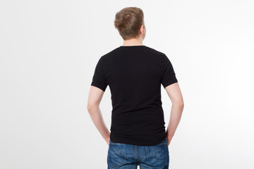 Fototapeta premium Young man wearing blank t-shirt isolated on white background. Copy space. Place for advertisement. Back shirt view