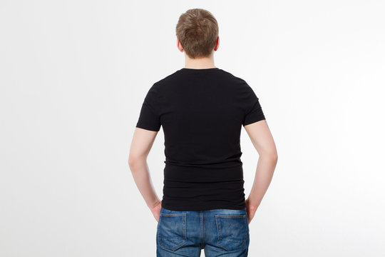 Young man wearing blank t-shirt isolated on white background. Copy space. Place for advertisement. Back shirt view