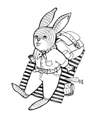 The rabbit in a shirt and jeans lies on cover outdoors and looks up.
