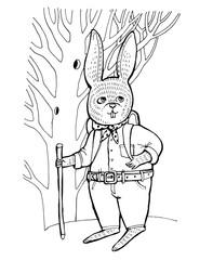 The rabbit in a shirt and jeans stands near the tree and looks up.
