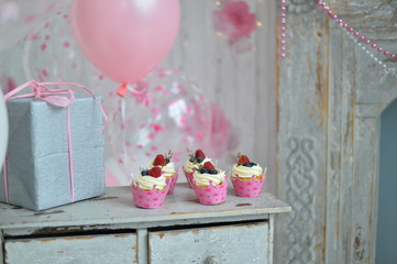 One year birthday decorations ideas. Decorations for holiday party. A lot of balloons pink and white colors. Cakes for birthday party. 