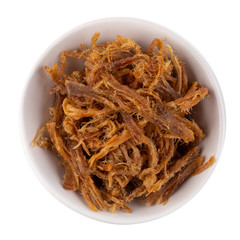 Dried shredded pork in a white bowl isolated on a white background