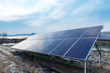 Large solar panels are being exposed to sunlight ,with blue sky